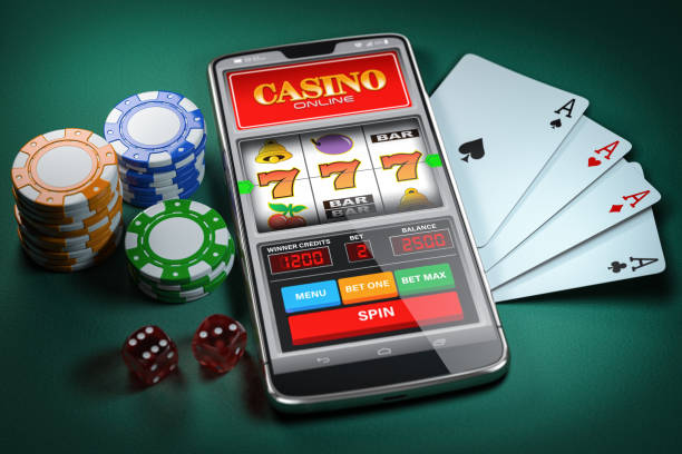 Close-up of a smartphone with casino games and playing cards