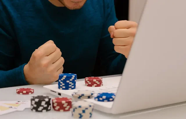 Man playing online casino on his laptop